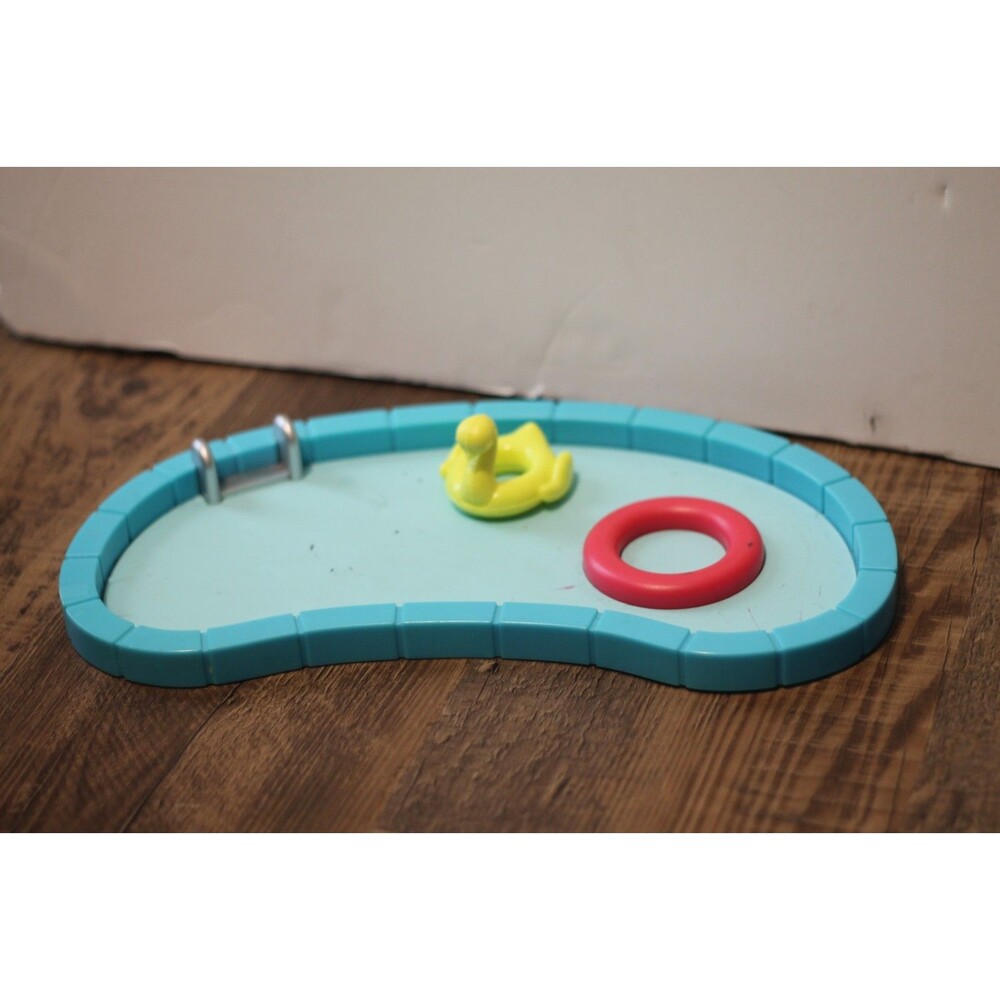Barbie pool and duck floatie